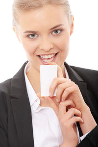 Portrait of a smiling young woman over white background