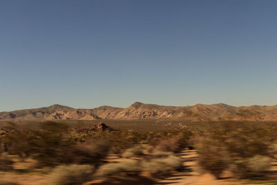 Scenic view of desert against clear sky