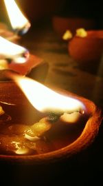Close-up of illuminated tea light candles