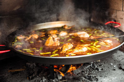 Close-up of meat cooking on barbecue grill