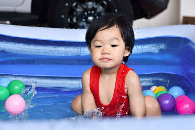Close-up of cute girl playing in pool