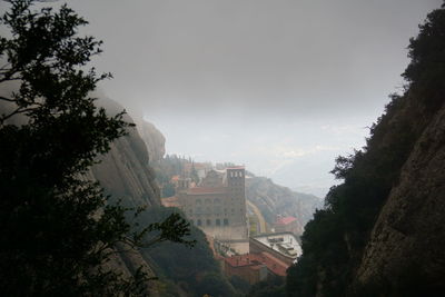 High angle view of trees and buildings against sky