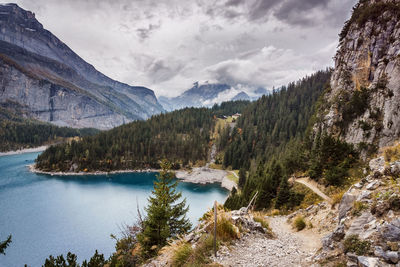 Scenic view of lake and mountains against sky