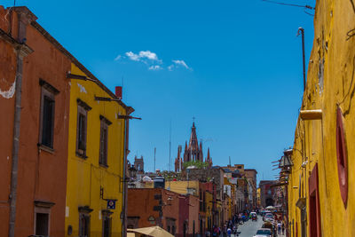 Low angle view of buildings in city against sky