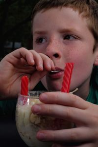 Close-up portrait of boy drinking drink