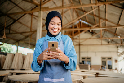 Young woman using mobile phone