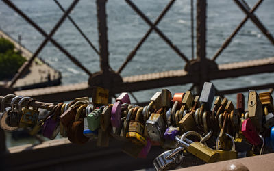 Close-up of padlocks hanging on railing