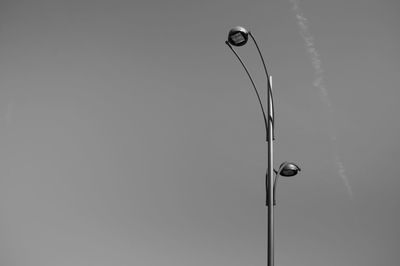 Low angle view of street light against sky