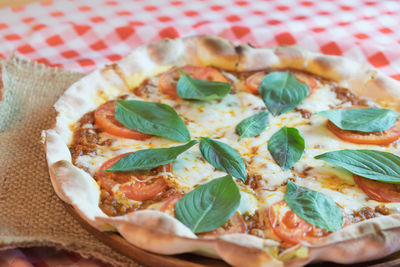 High angle view of pizza served on table