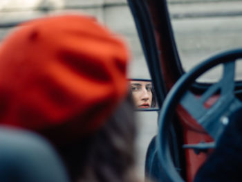 Portrait of man seen through car window