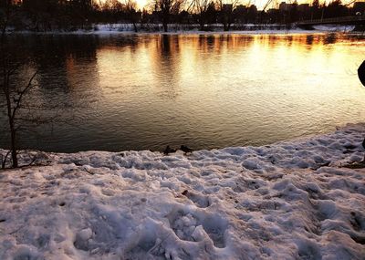 Scenic view of lake during sunset