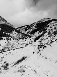 Scenic view of snow covered mountains against sky