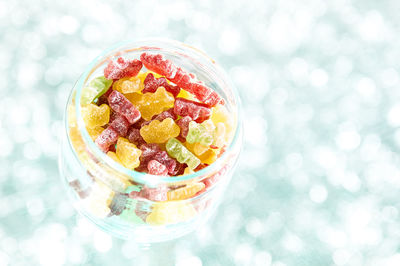 High angle view of fruits in glass bowl on table