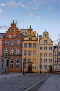 Buildings in city against sky