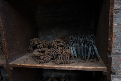 Close-up of rusty keys against wall