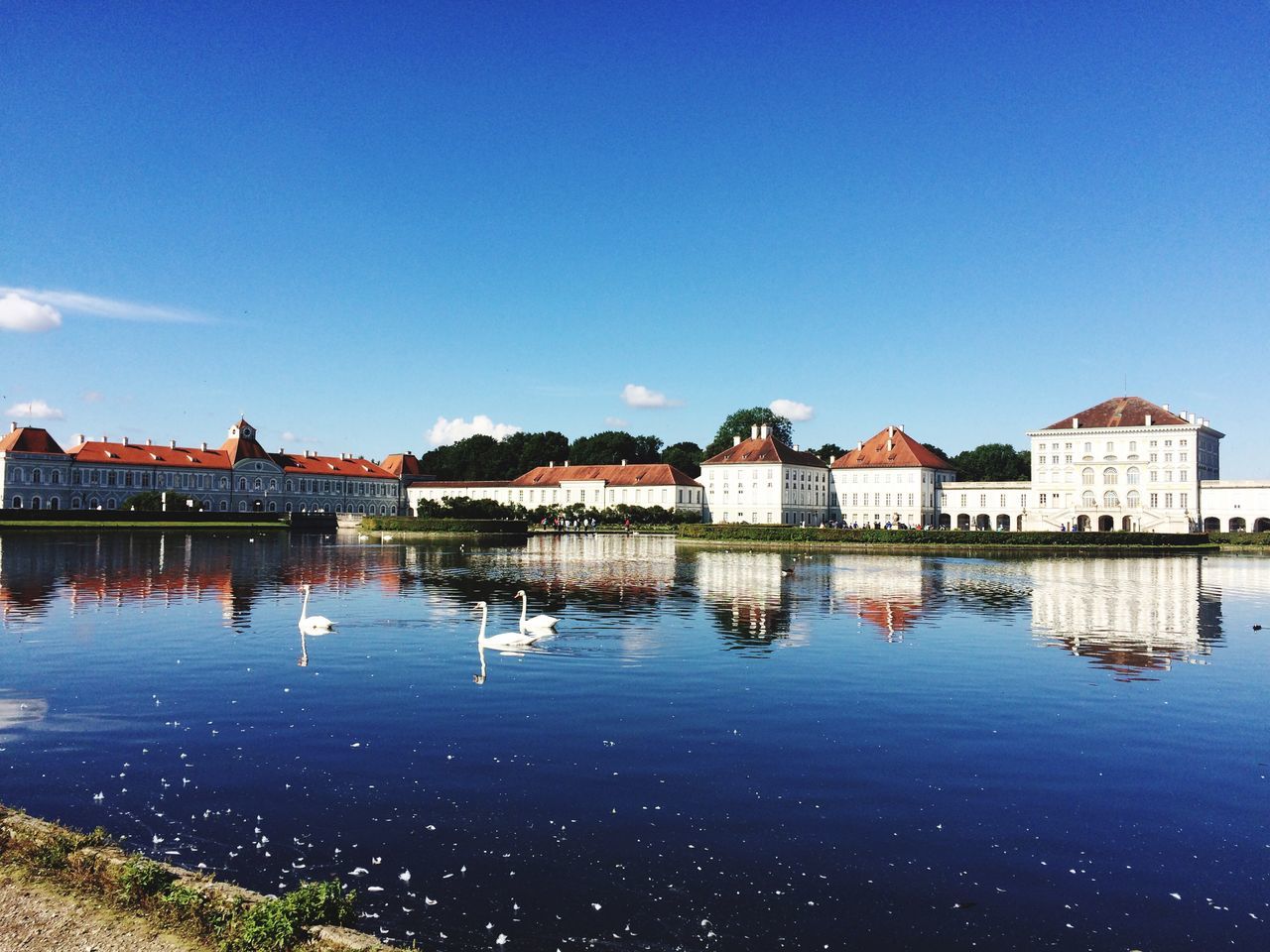 water, built structure, architecture, sky, building exterior, reflection, building, blue, copy space, nature, waterfront, no people, clear sky, lake, outdoors, house, day, residential district