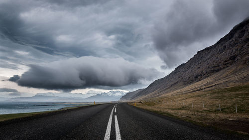 Road amidst landscape against sky