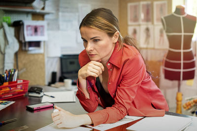 Portrait of woman working on table