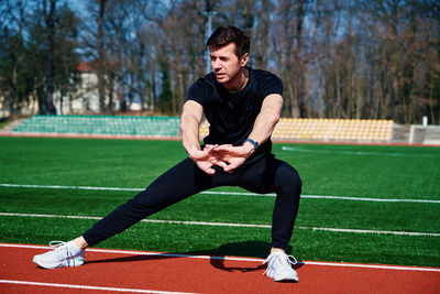 Sport man preparing for jogging outdoors