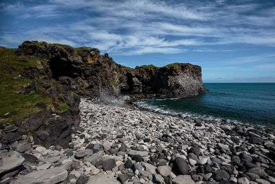 Scenic view of sea against cloudy sky