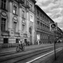 Bicycle on road against buildings in city