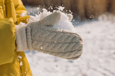 Close-up of snow on person during winter