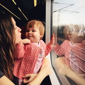 Baby with mother in train