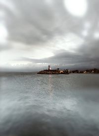 Scenic view of sea against cloudy sky