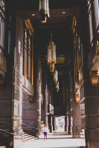 Low angle view of illuminated lights hanging in building