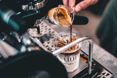 Person hand holding coffee cup