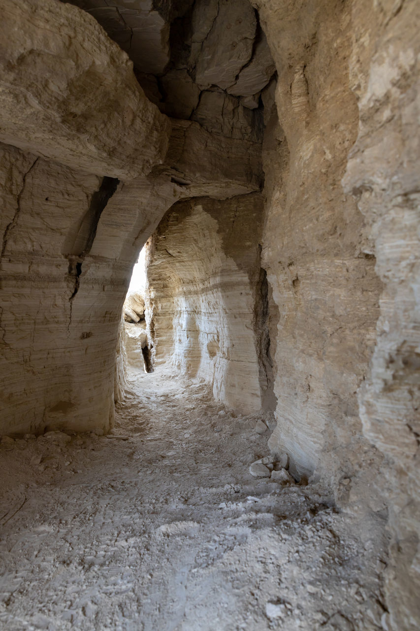 architecture, history, rock, cave, the past, arch, indoors, ancient, rock formation, built structure, tunnel, no people, nature, travel destinations, travel, geology, day, formation, building, entrance, old ruin, adventure, hole, subway, tourism, exploration, sunlight, old, public transportation, stone material