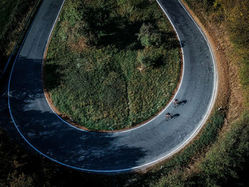 High angle view of people riding bicycles on road