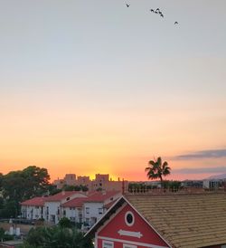 View of buildings against sky during sunset