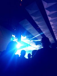 High angle view of silhouette people at music concert