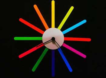 Close-up of clock against black background