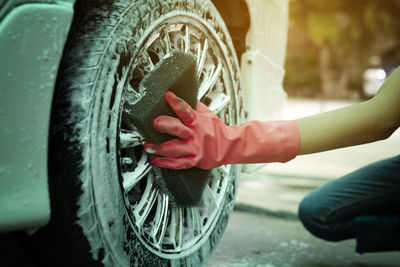 Close-up of a hand holding a car