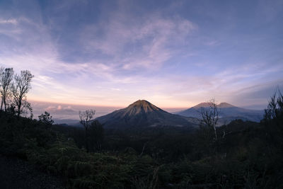 Scenic view of mountains against sky during sunset