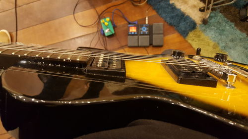 Close-up of playing guitar