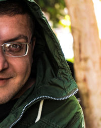 Close-up portrait of young man wearing eyeglasses