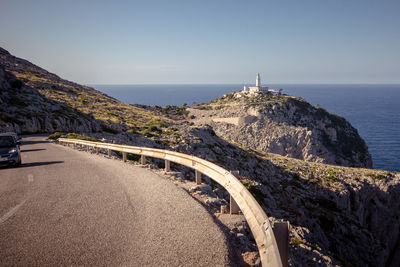 Scenic view of sea with lighthouse against clear sky, cap formentor