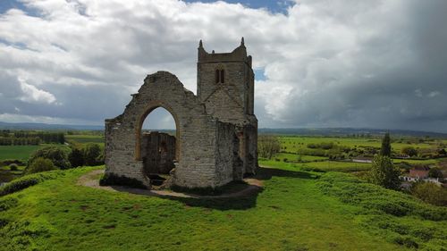 Old ruins of building against sky