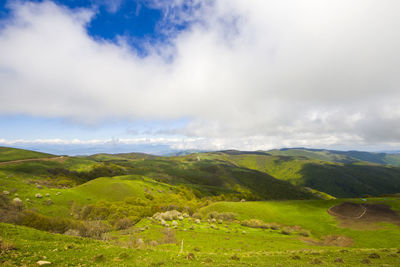 Mountain landscape in georgia. landscape from didgori road. clouds and blue sky.