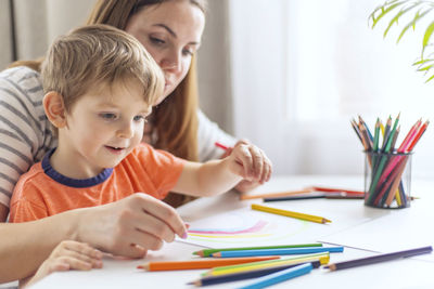 Close-up of boy drawing at home