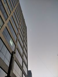 Low angle view of modern building against clear sky