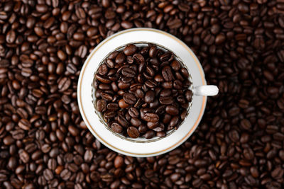 Close-up of coffee beans and cup