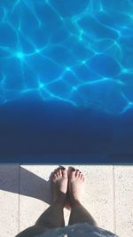 Low section of woman in swimming pool