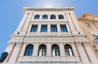 Low angle view of building against blue sky