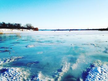 Scenic view of lake against clear sky