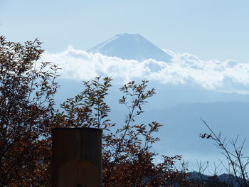 Low angle view of snowcapped mountain against sky