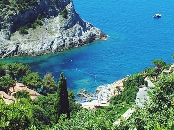 Scenic view of sea with rocks in background